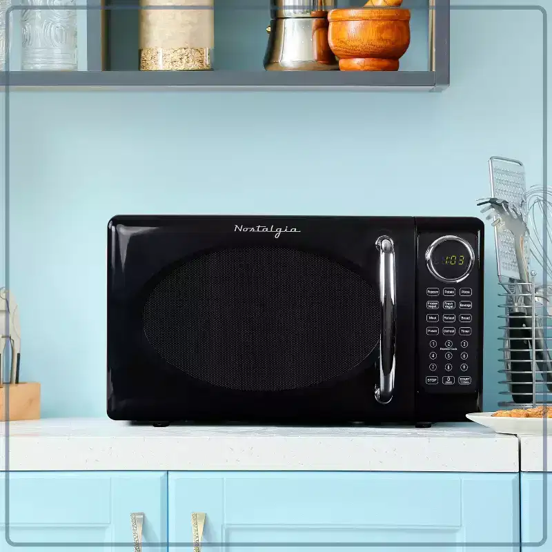 Nostalgia Retro Compact 0.7 Cu Ft & 700-Watt Countertop Microwave Oven