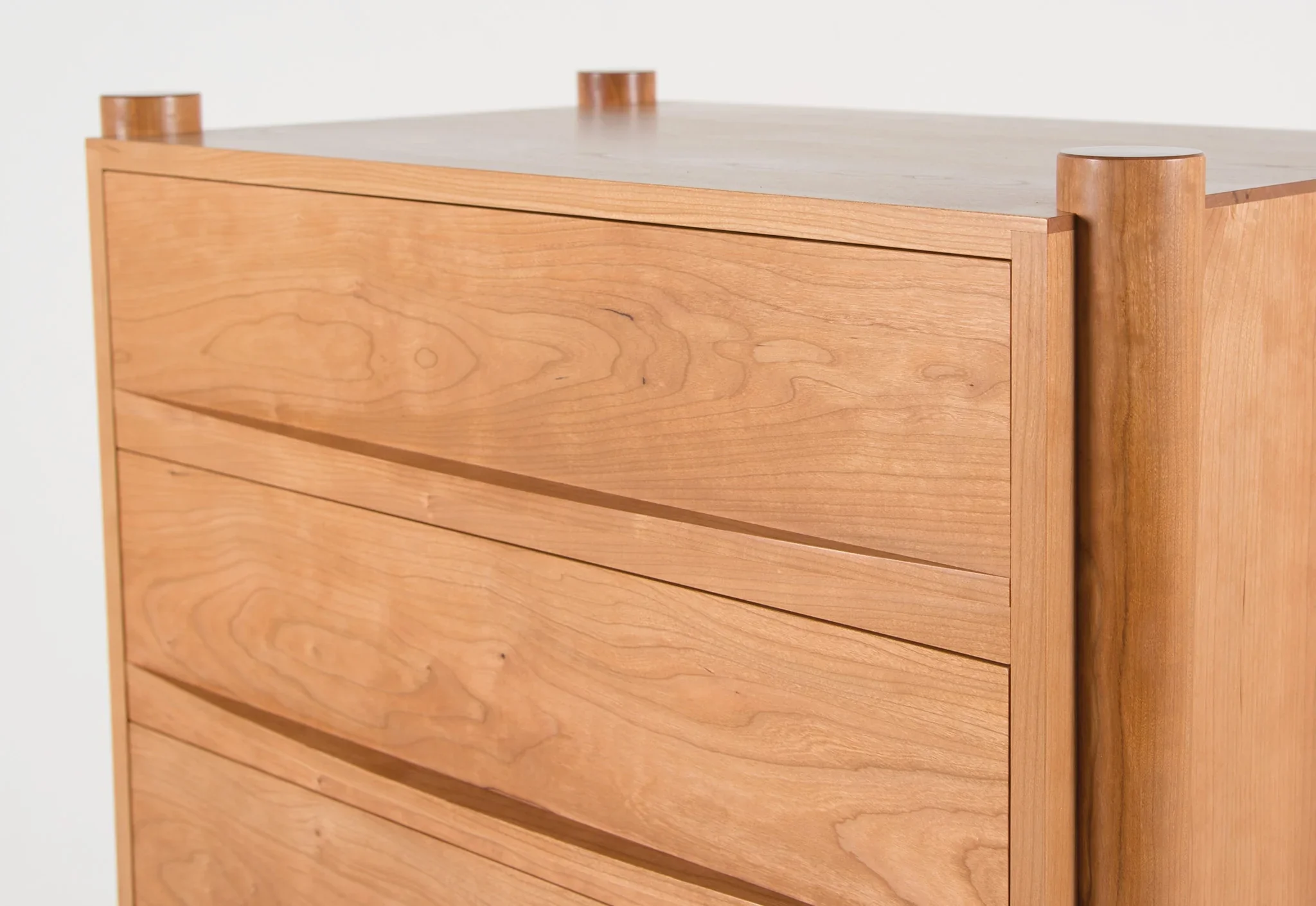 Dresser - Vertical - From its tapered legs and exposed end grain to its elliptical drawer pulls, the is confident in