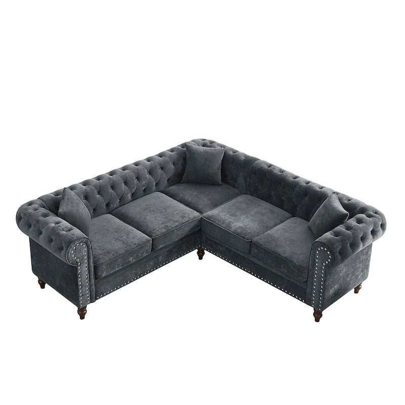L-shaped sofa with deep-stitched details and curled armrests.