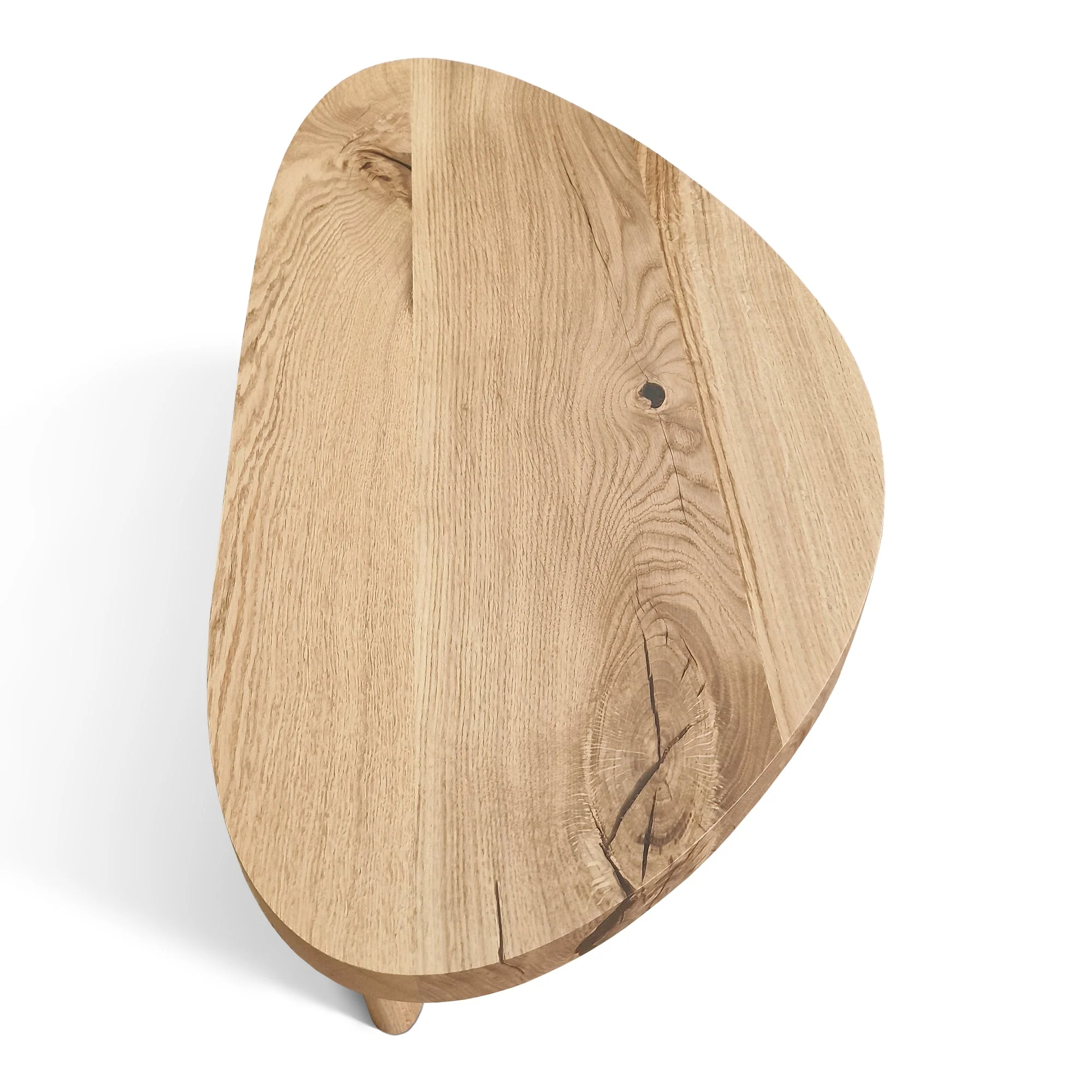 Oak Coffee Table - The Coffee Table showcases a beautifully organic shape crafted from solid oak - highlighting its naturally smooth surface and