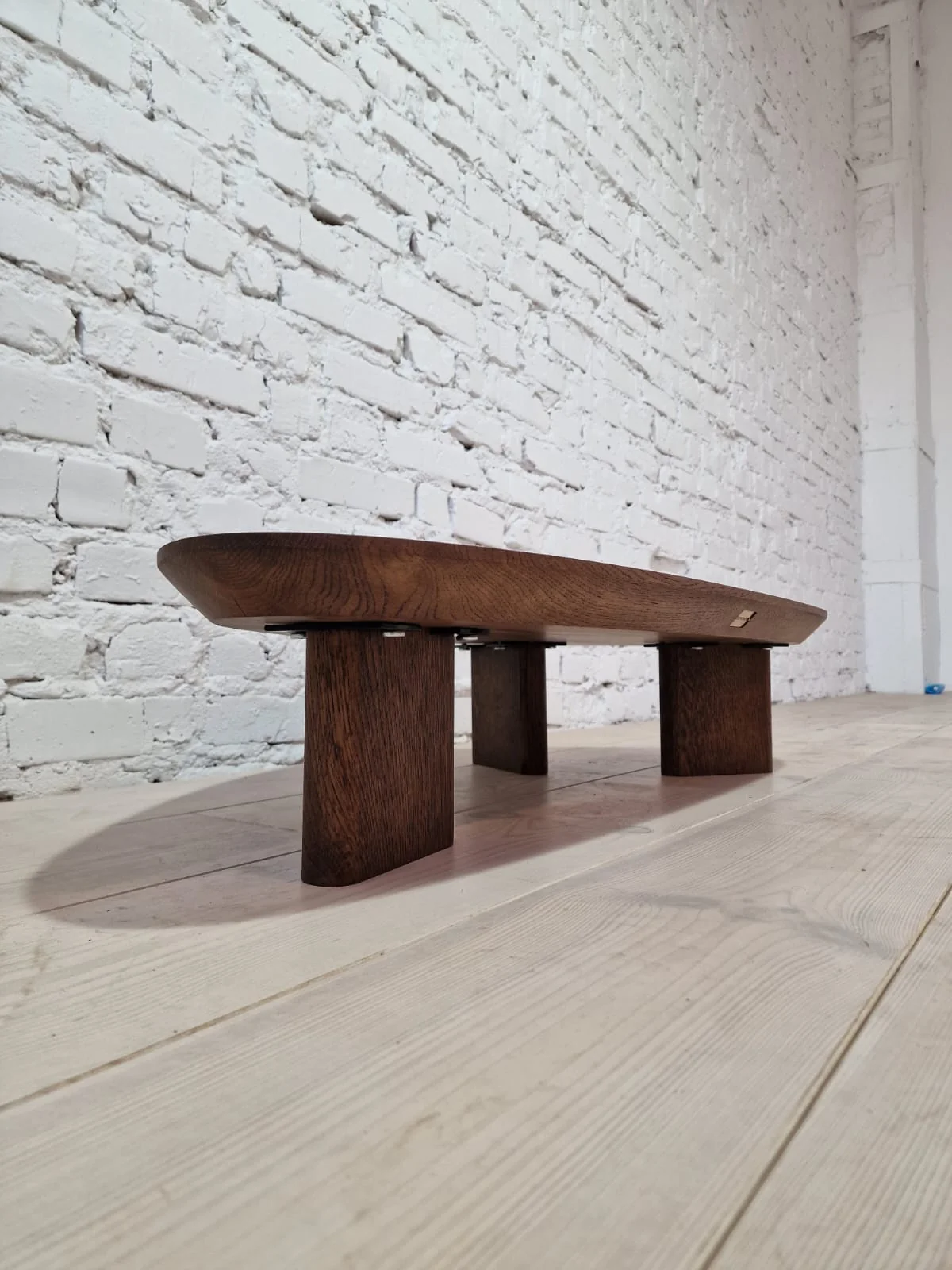 Oak Coffee Table - The Coffee Table showcases a beautifully organic shape crafted from solid oak - highlighting its naturally smooth surface and