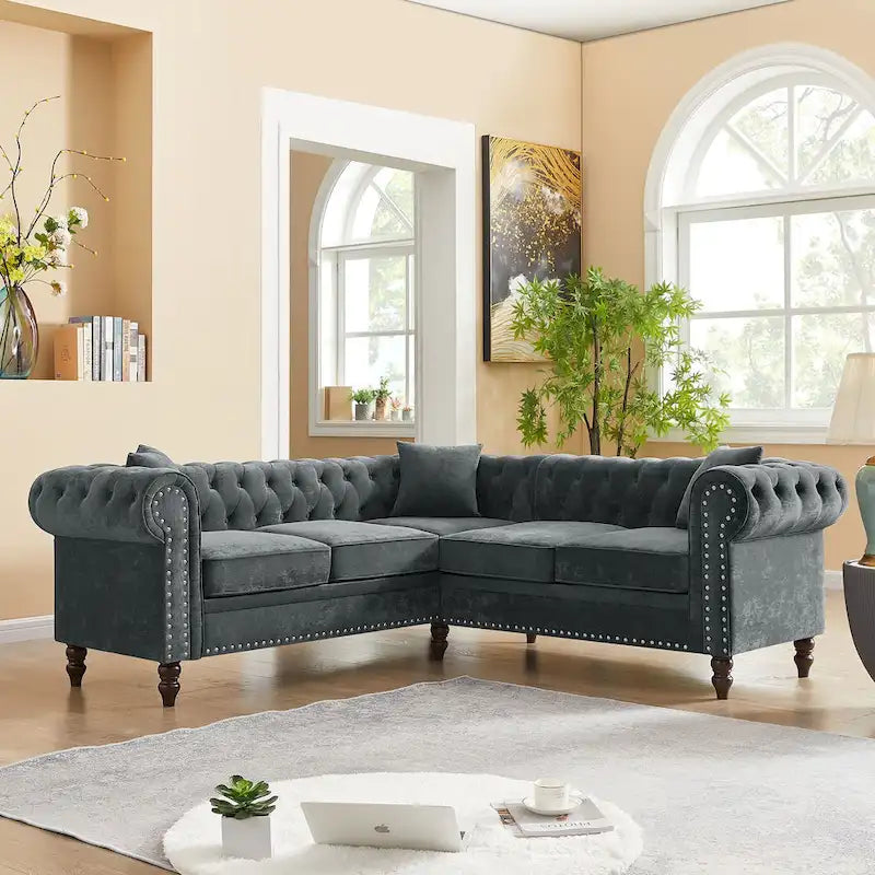 L-shaped sofa with deep-stitched details and curled armrests.