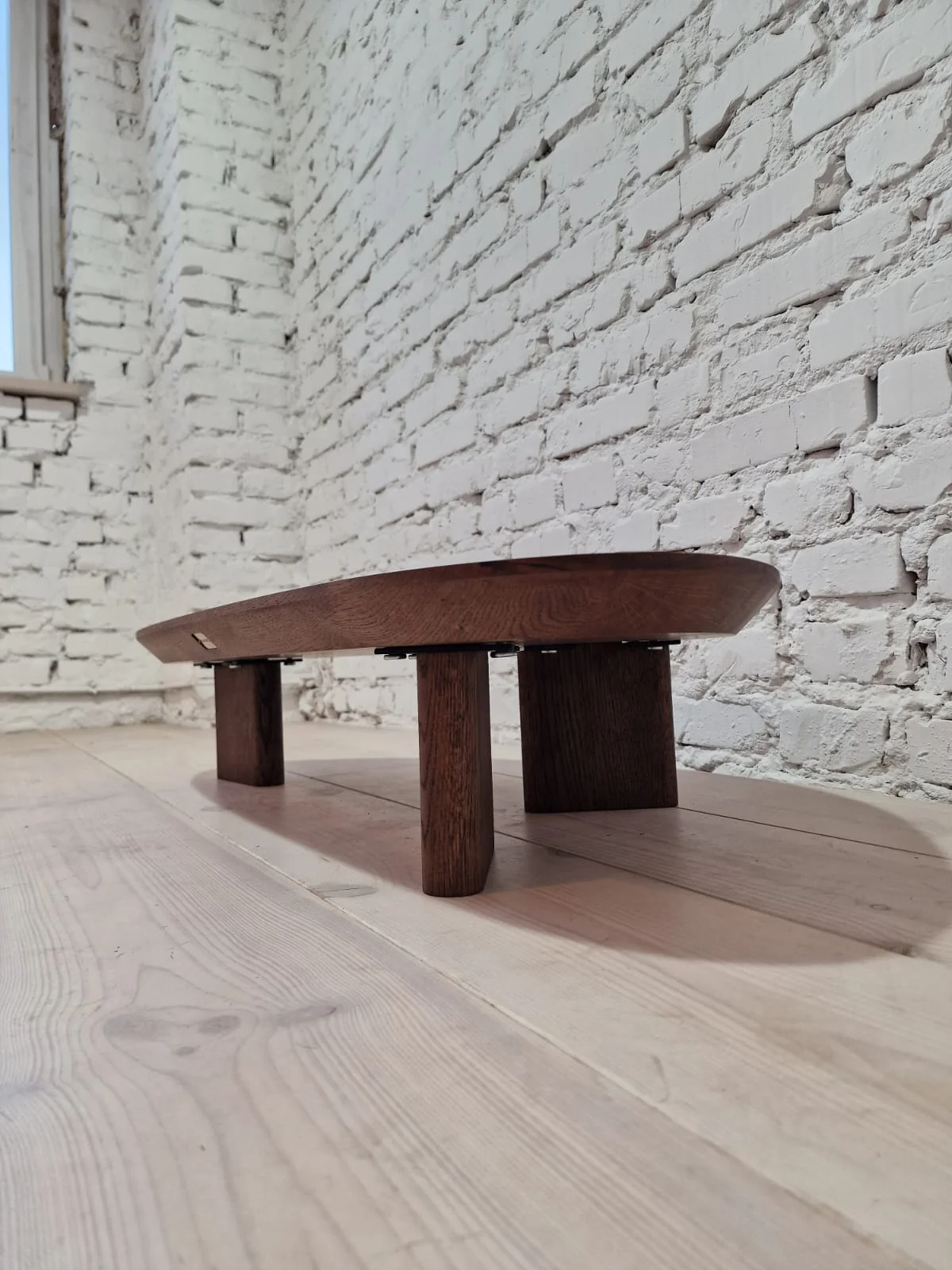Oak Coffee Table - The Coffee Table showcases a beautifully organic shape crafted from solid oak - highlighting its naturally smooth surface and