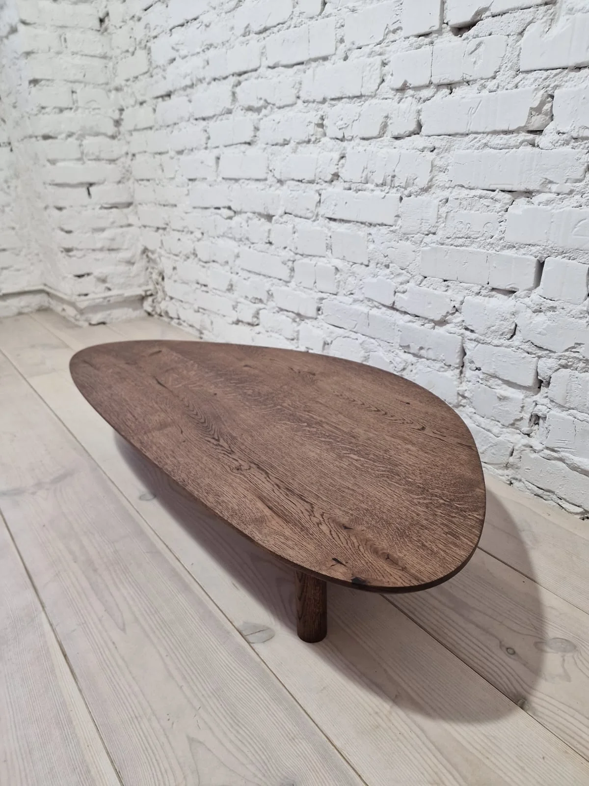 Oak Coffee Table - The Coffee Table showcases a beautifully organic shape crafted from solid oak - highlighting its naturally smooth surface and