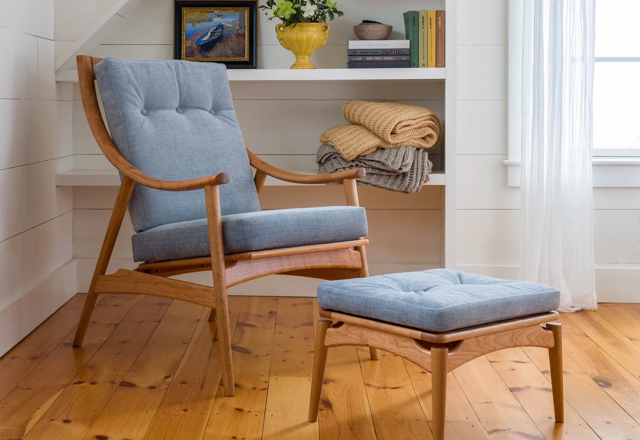 Lounge Chair - Designed with sweeping, curved arms, slender spindles along the back, and slender, gently raked legs