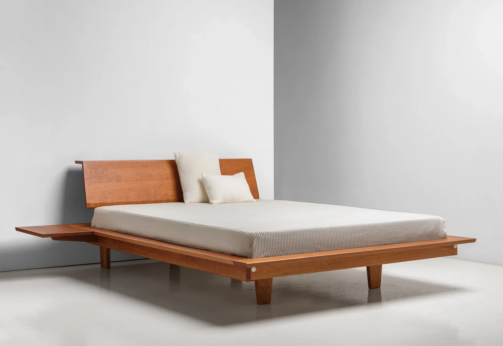 Platform Bed - The is minimalist to its core, stripping away pretense with its series of broad, surrounding surfaces