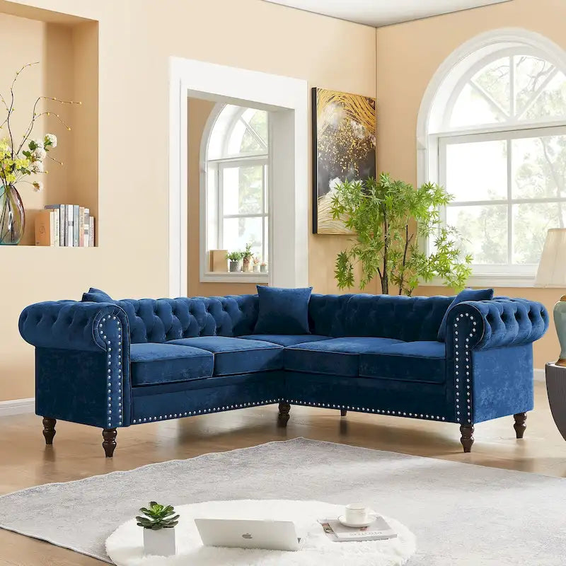 L-shaped sofa with deep-stitched details and curled armrests.