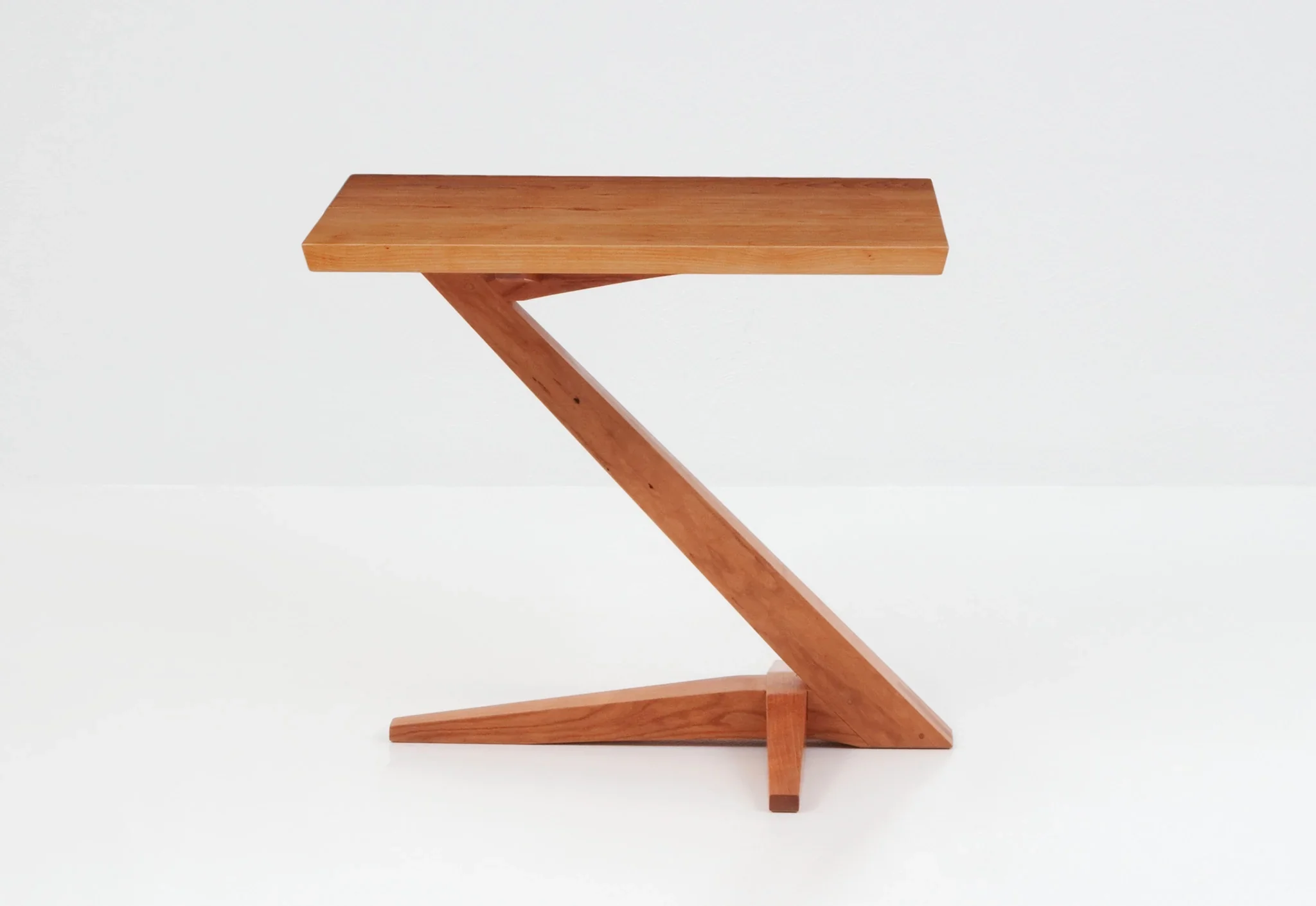 Cantilever Side Table - Perched atop a solid cherry or walnut base that rises from its splayed foot on a