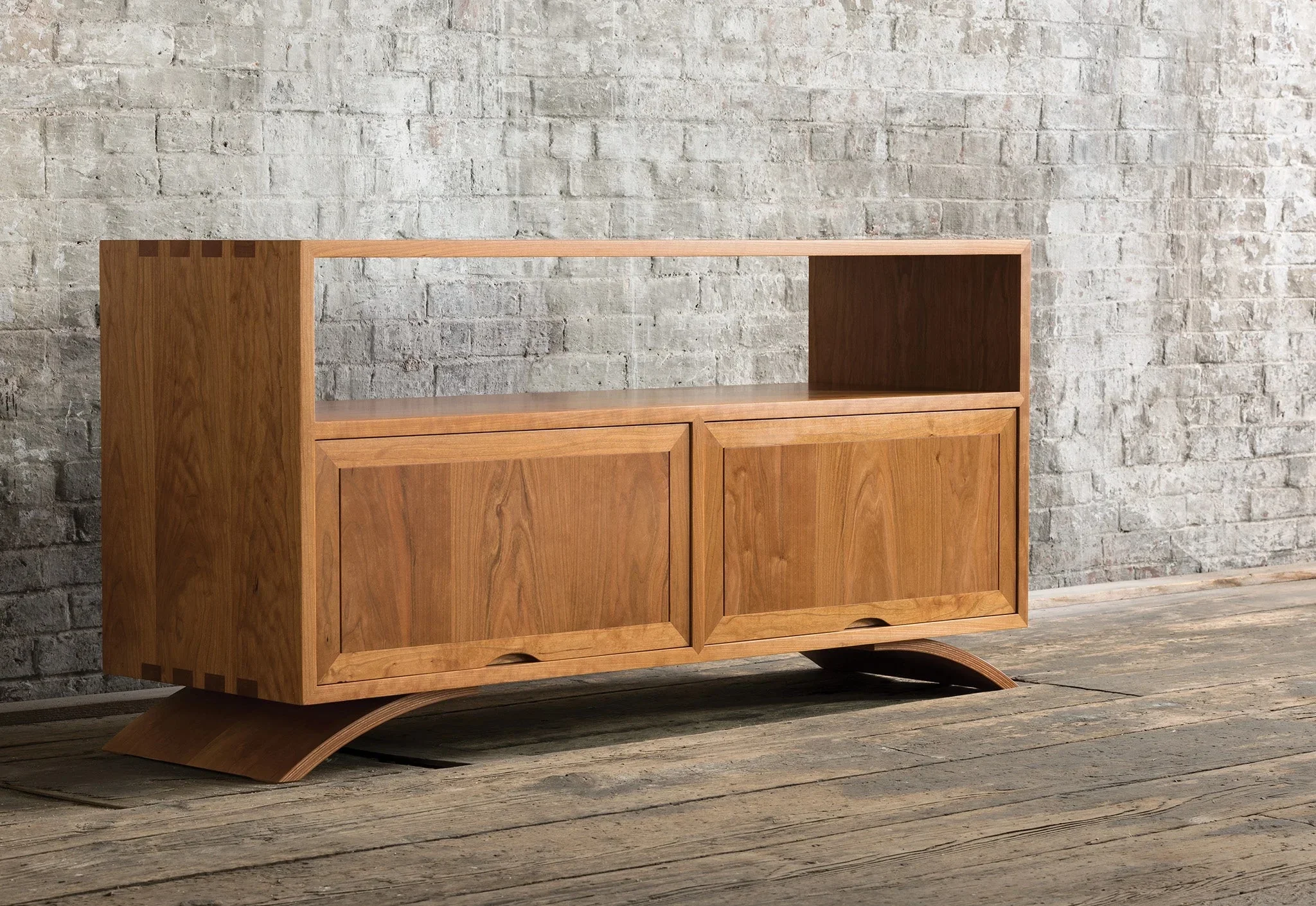 Credenza - The Credenza has two exposed surfaces for lamps, photographs, and reading materials with an enclosed storage
