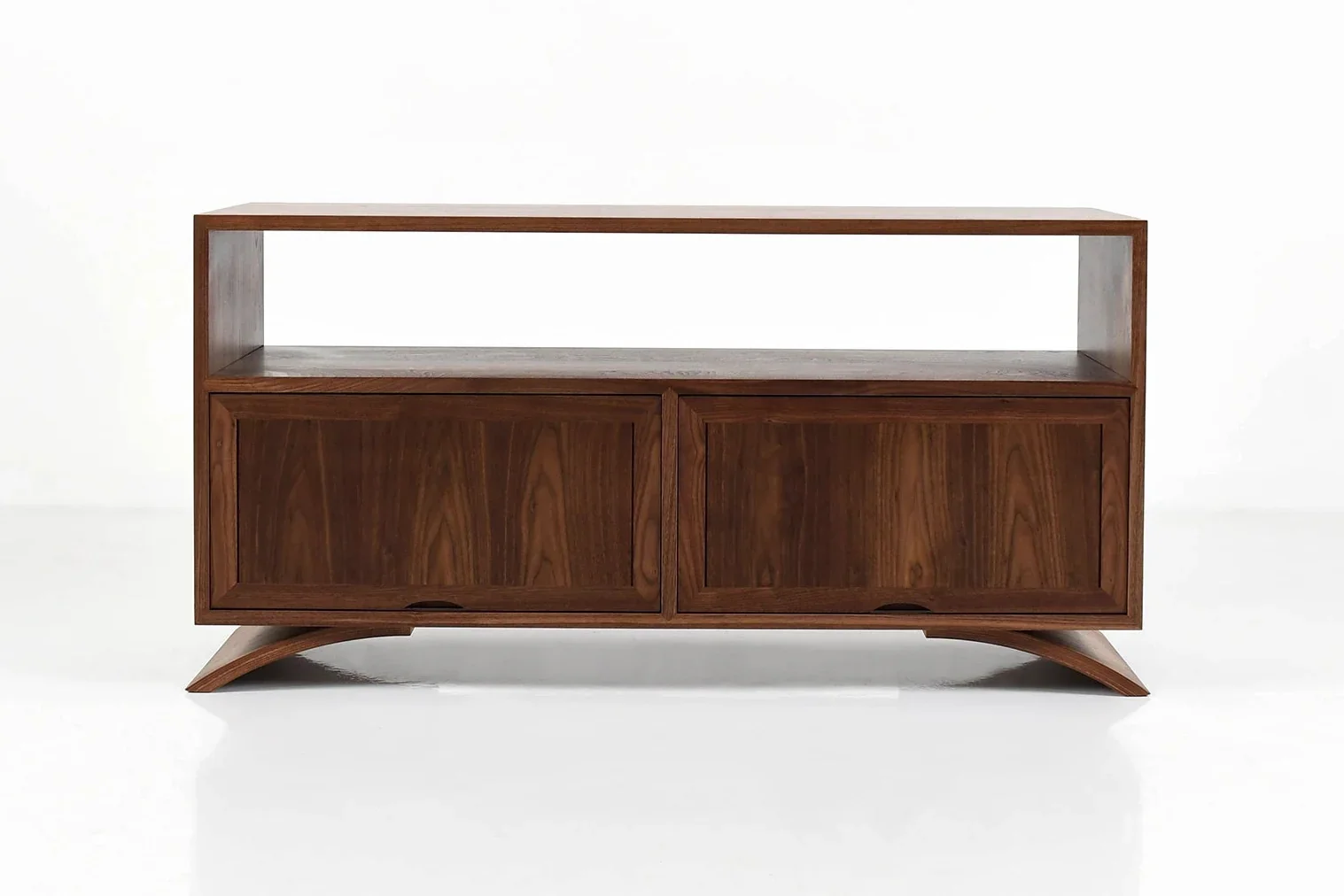 Credenza - The Credenza has two exposed surfaces for lamps, photographs, and reading materials with an enclosed storage