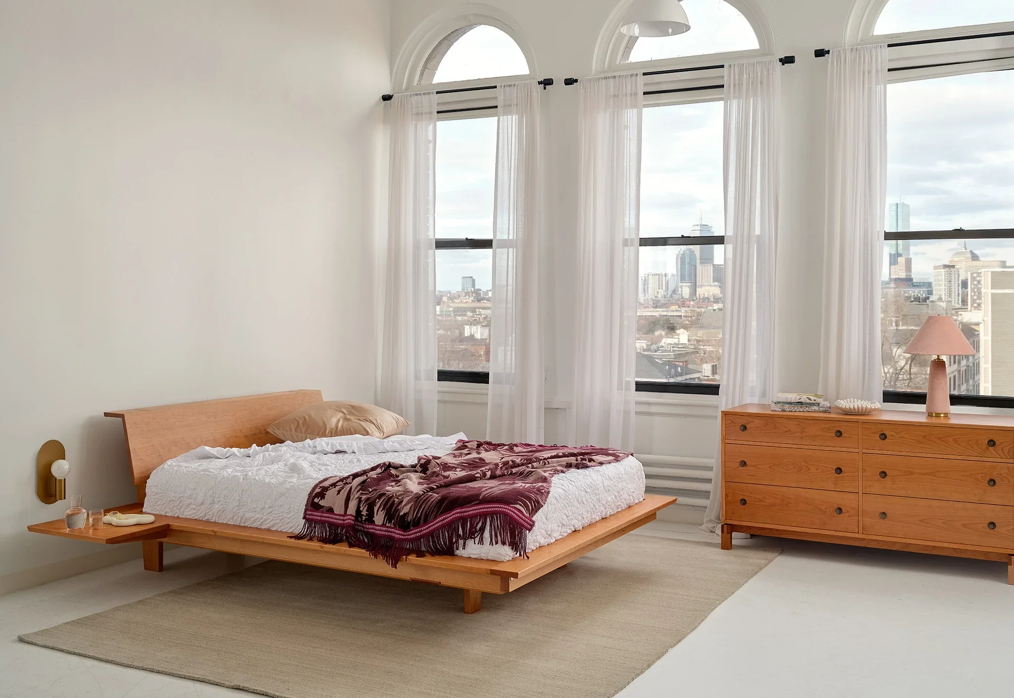 Platform Bed - The is minimalist to its core, stripping away pretense with its series of broad, surrounding surfaces