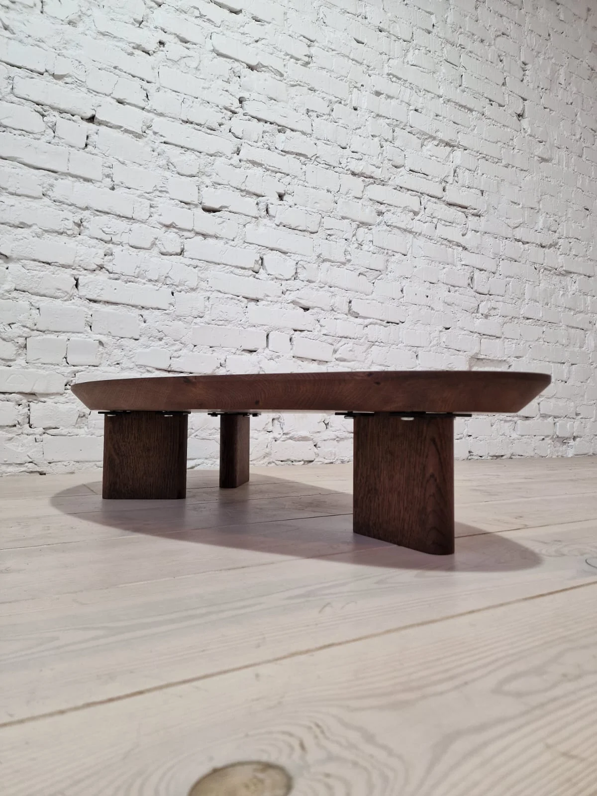 Oak Coffee Table - The Coffee Table showcases a beautifully organic shape crafted from solid oak - highlighting its naturally smooth surface and