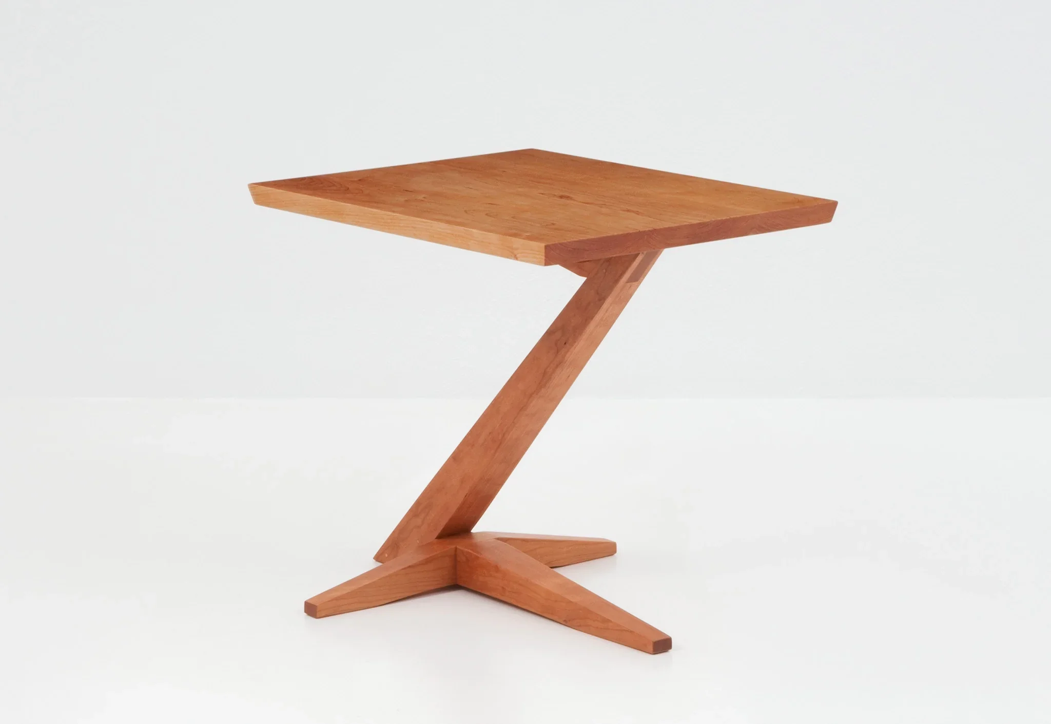Cantilever Side Table - Perched atop a solid cherry or walnut base that rises from its splayed foot on a