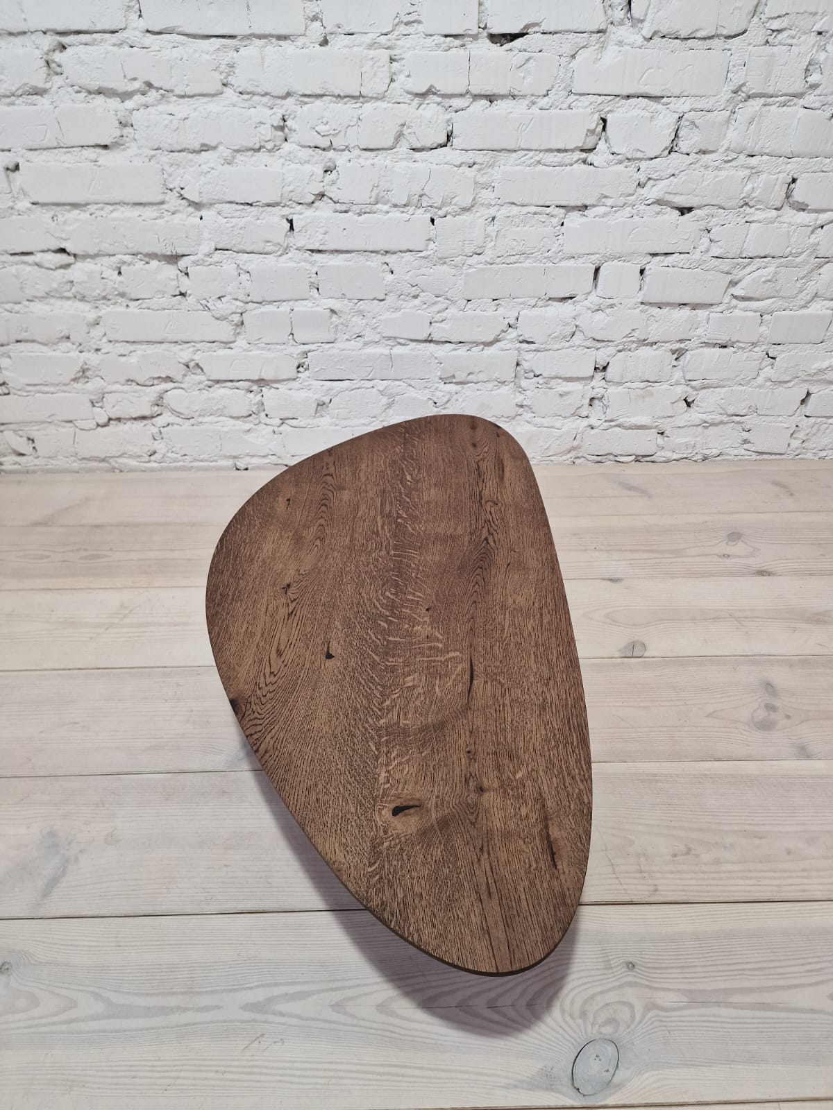 Oak Coffee Table - The Coffee Table showcases a beautifully organic shape crafted from solid oak - highlighting its naturally smooth surface and