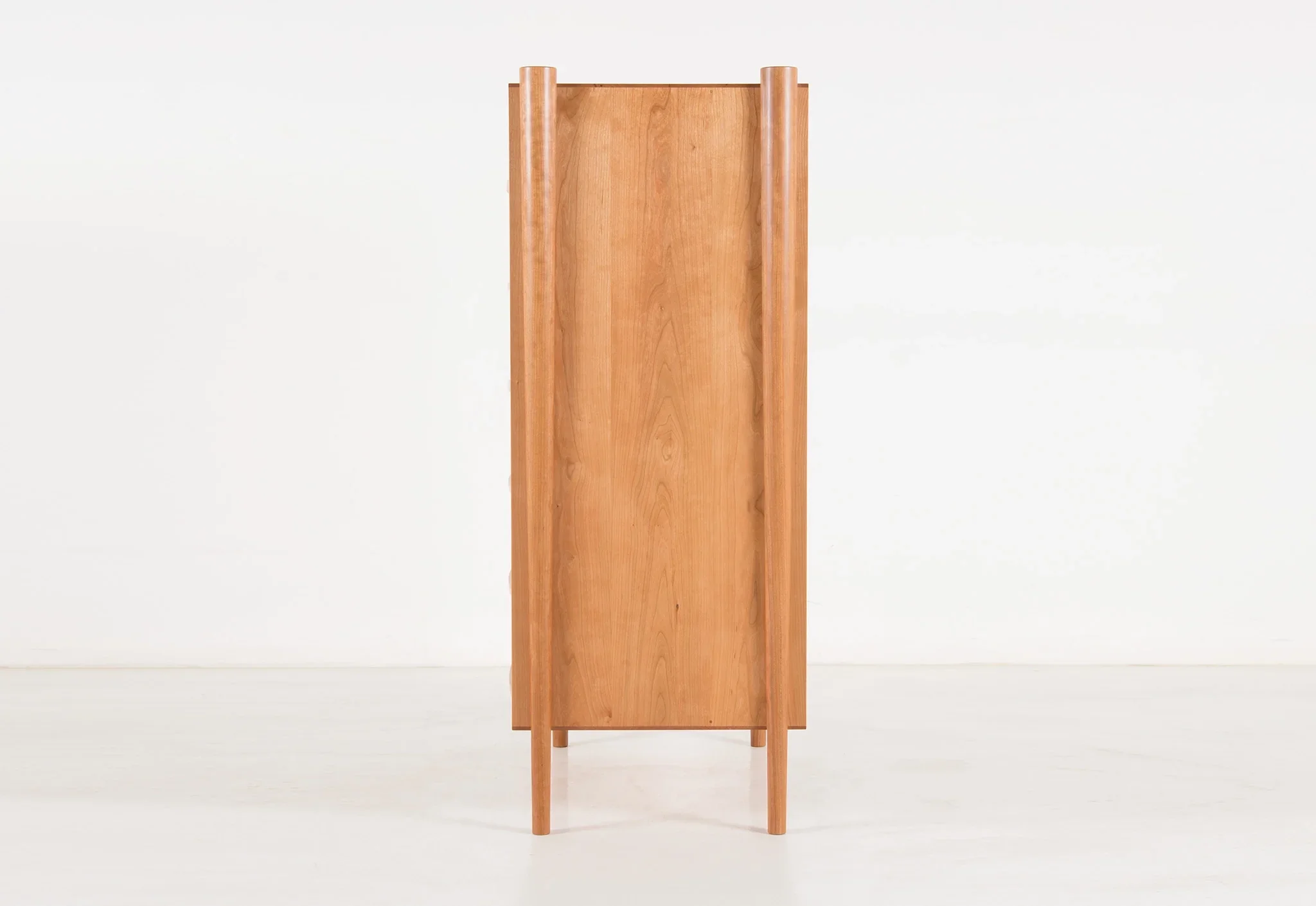 Dresser - Vertical - From its tapered legs and exposed end grain to its elliptical drawer pulls, the is confident in