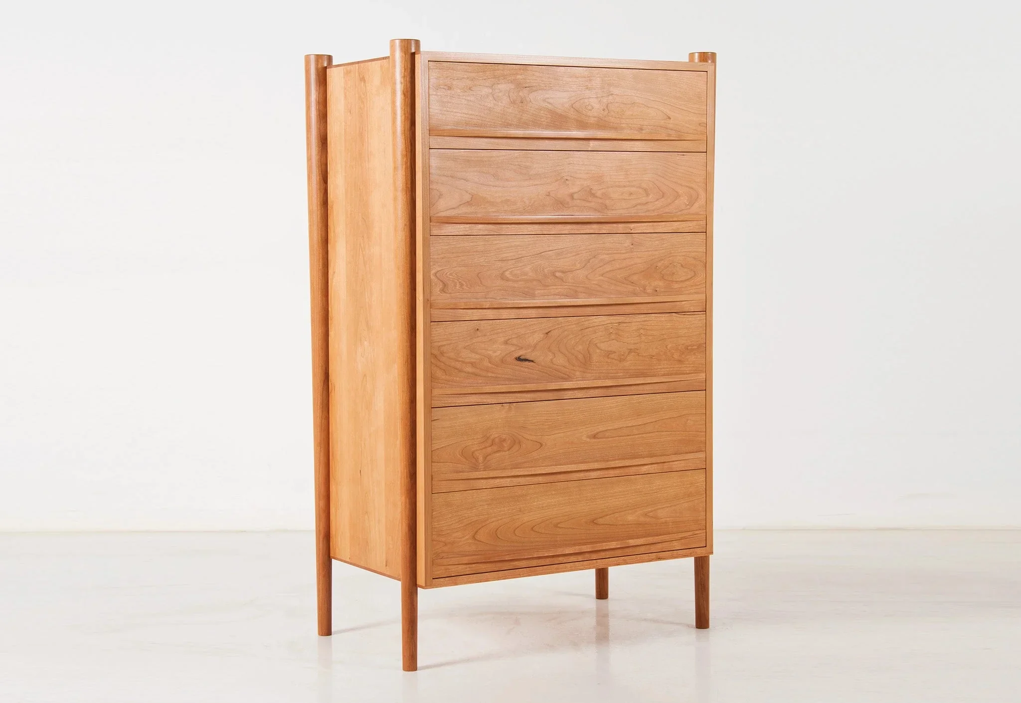 Dresser - Vertical - From its tapered legs and exposed end grain to its elliptical drawer pulls, the is confident in