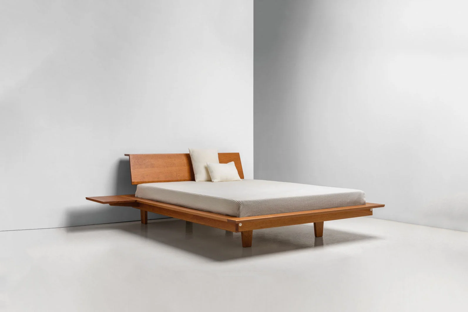 Platform Bed - The is minimalist to its core, stripping away pretense with its series of broad, surrounding surfaces