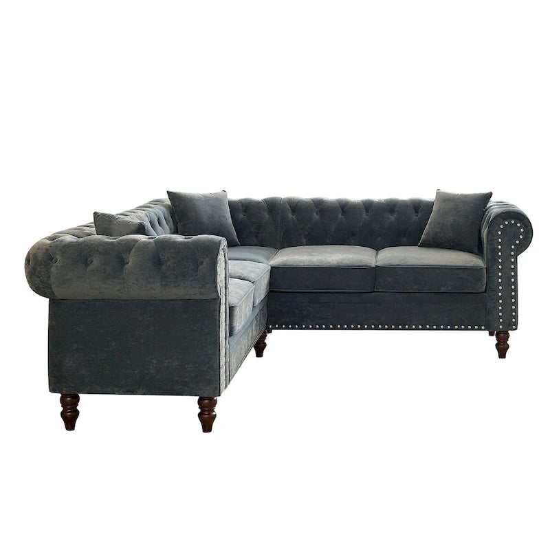 L-shaped sofa with deep-stitched details and curled armrests.