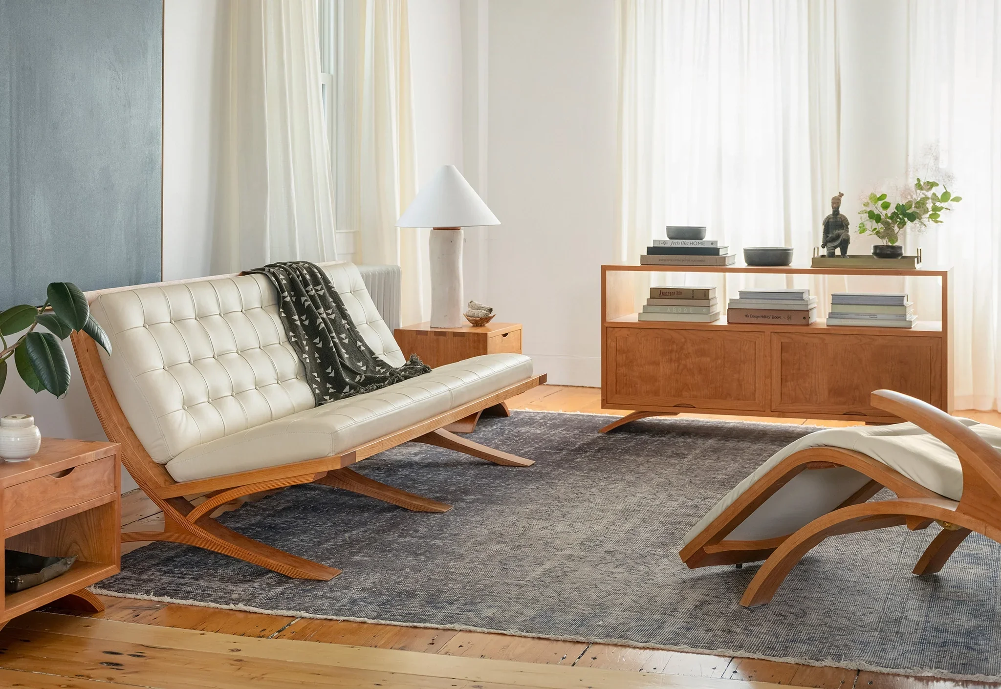 Credenza - The Credenza has two exposed surfaces for lamps, photographs, and reading materials with an enclosed storage