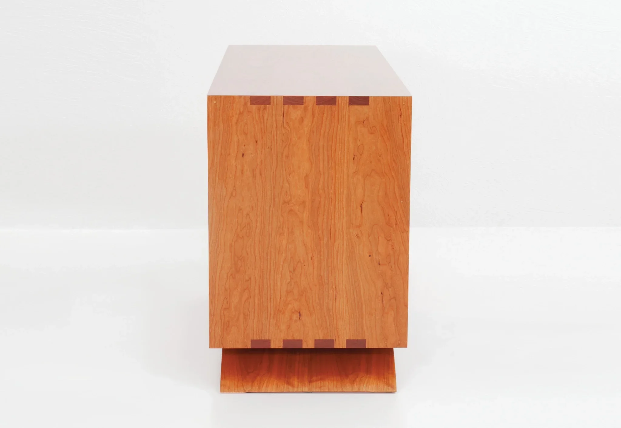 Credenza - The Credenza has two exposed surfaces for lamps, photographs, and reading materials with an enclosed storage