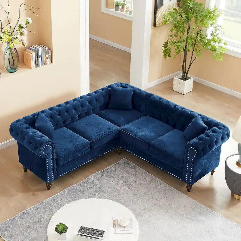 L-shaped sofa with deep-stitched details and curled armrests.